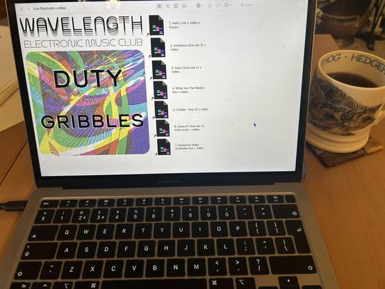 Photo of a MacBook air with finder open to a folder with links to Ableton tunes arranged in a setlist. .