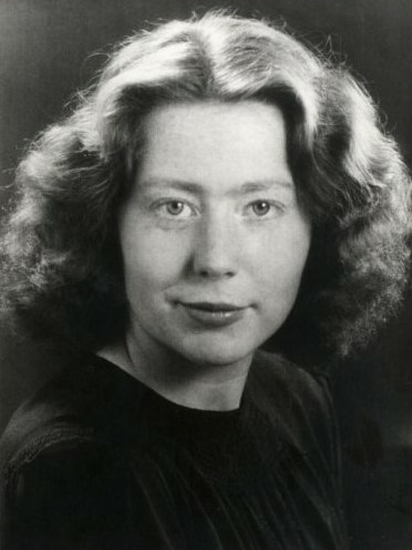 black and white studio photo of Hannie Schaft. She is a white woman with fair hair.