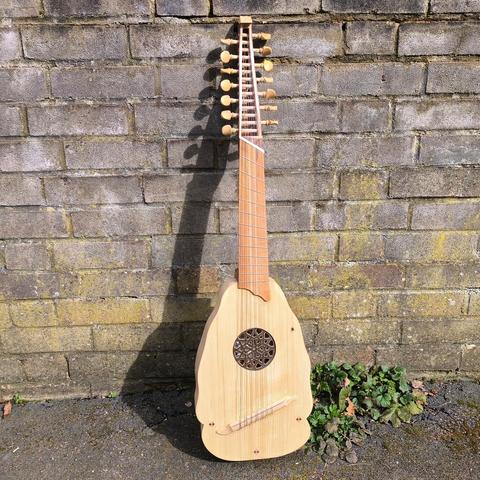 An Orpharion I built, standing against a wall in the spring sunshine.