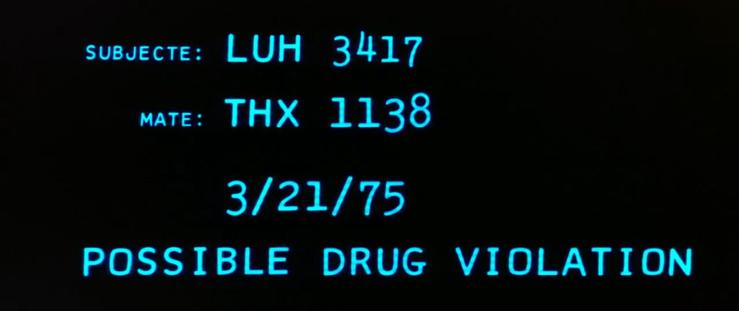 Text on a screen reading: "subjecte: LUH 3417, mate: THX 1138, 3/2/75, possible drug violation." It spells subject with an extra E on the screen.
