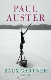 The cover of the novel Baumgartner by Paul Auster, which features a photo of a hand-operated water pump in the middle of a frozen rural landscape.