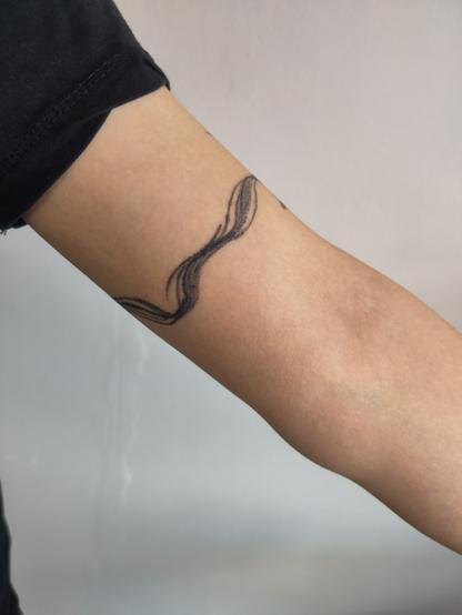 healed brushstroke with turtle swimming around the arm