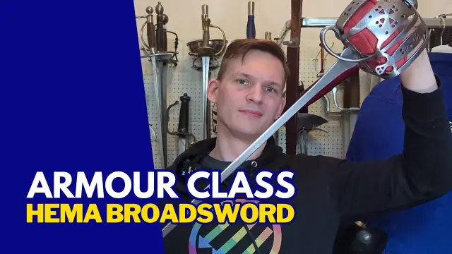 Text: Armour Class HEMA Broadsword
Picture: Me holding a basket hilt into the camera.