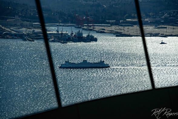 Photograph of a Seattle ferry crossing Elliot Bay, taken from atop the Space Needle's observation deck.