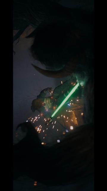 Vertical: Cal Kestis wielding a green lightsaber is mid-fight, surrounded by sparks and glowing effects. A dark, ominous figure looms in the foreground, creating a dramatic atmosphere.