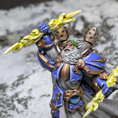 Tabletop Miniature of a bearded man in armour, with robes and a bright lightning bolt in each hand.