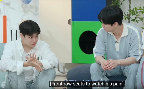 Seungmin looks uncomfortable after eating something he doesn't like. Lee Know watches him closely. Caption: [Front row seats to watch his pain]