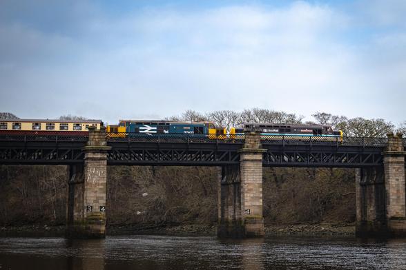 A heritage train (1Z37) hauled by 37403 (Isle of Mull) and 37401 (Mary Queen of Scots) on the bridge over the River Dee
