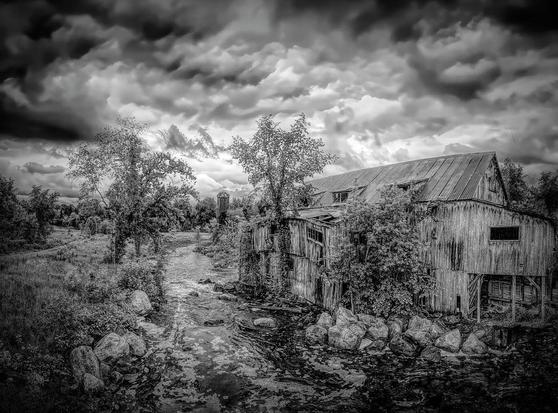 Within the serene landscapes of Balaclava, a small village in Renfrew County, Ontario, stands a weathered and crumbling relic from a bygone era - a once-proud mill that now wears the scars of time.