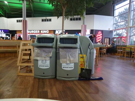 Two bins, both tagged general waste instead of one tagged for recyclable materials