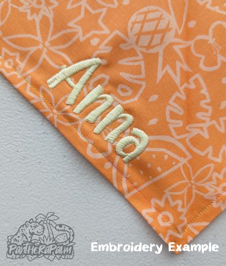 Tropical orange bandana with 'Anna" embroidered in light yellow