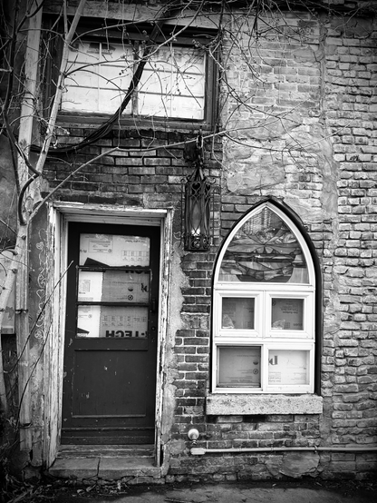 Old building with door and stained glass window