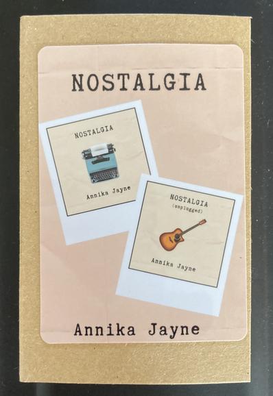 The front of the Nostagia cassette tape displaying both covers of the Nostalgia EP and the Nostalgia unplugged album!