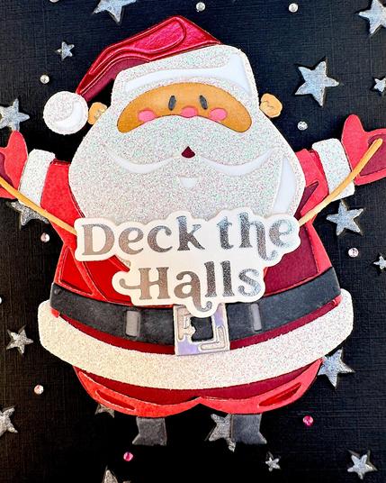 Greeting card with a traditional Santa figure holding up some string with the greeting "Deck the Halls" on it.