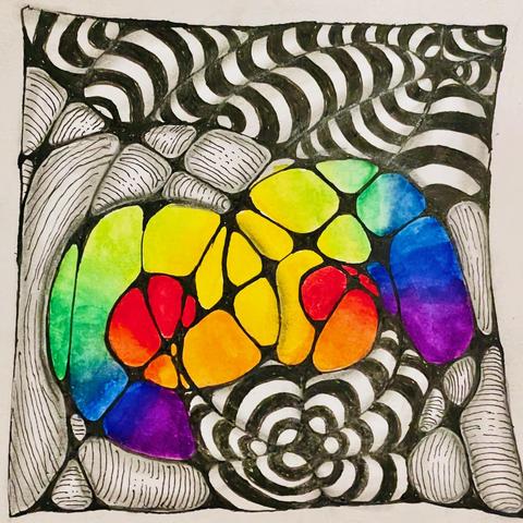 A zentangle tile with some typical zentangle patterns. In the middle, two swirls appear that painted in very bright colors of the rainbow that blend into each other.