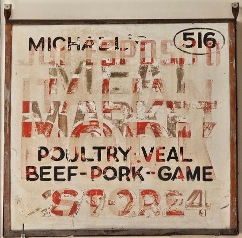 A meet market sign that show evidencd of having been painted over at least 3x, ghostly images of text over text over text