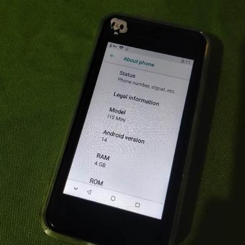 Photo of a mini 3.5" phone with the About info  saying that it has Android 14