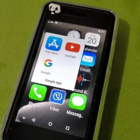 Photo of a mini 3.5" phone with the Play Store icon looking like an iOS icon