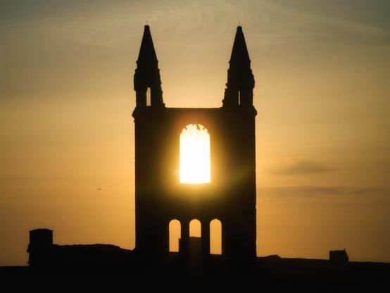 sun shining through cathedral silhouette
