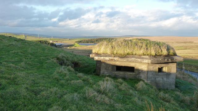 moorland landscape,  WWII pill box, slanting light from sunset
