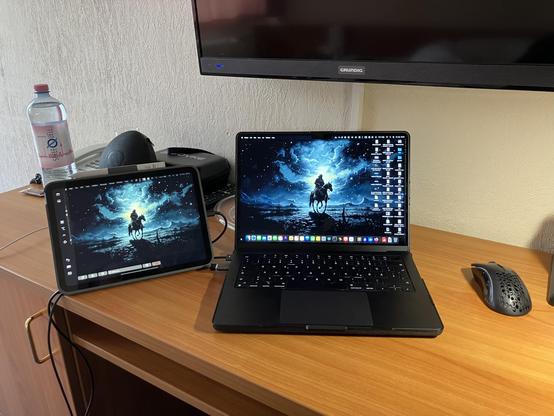 Picture of a Macbook and iPad "the working station"