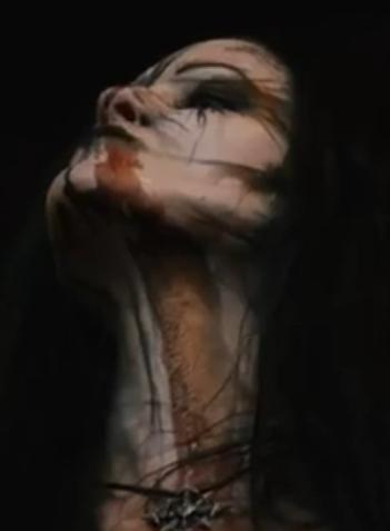 portrait picture of a young woman wearing so called corpse paint makeup, holding her head up. The picture has been slightly modified to look a bit surrealistic