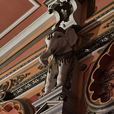 Carved elephant on high wall