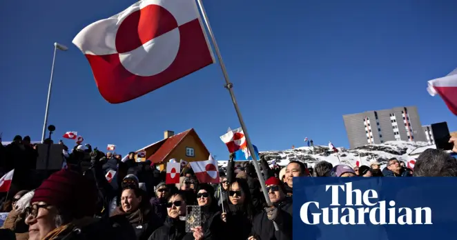People take part in a march to the US consulate under the slogan ‘Greenland belongs to the Greenlandic people’, in Nuuk. Photograph: Christian Klindt Soelbeck/AP