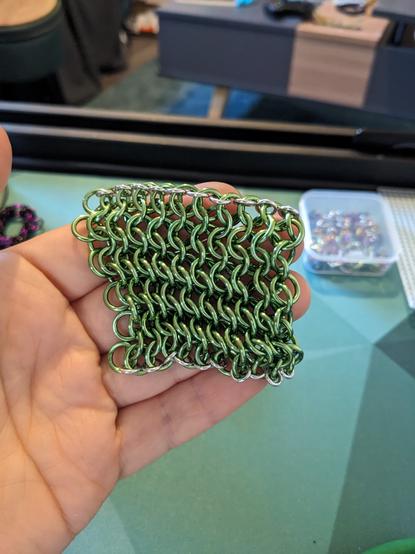 A sheet of green European 4-in-1 held in my hand
