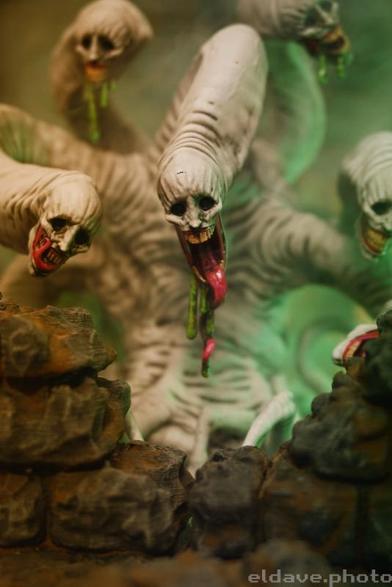 The false hydra, its pale body and multiple eyeless heads creeping through a hole in a stone wall. Roll initiative?