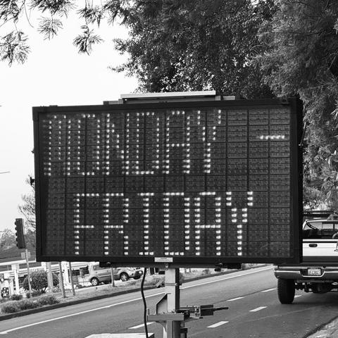 a road work matrix sign saying “monday - Friday” in a condensed style