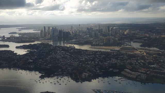 Sydney central business district under clouds. Shot out of a dash 8 window on approach to Kingsford Smith airport