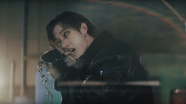 Bang Chan looking deranged while biting his thumb