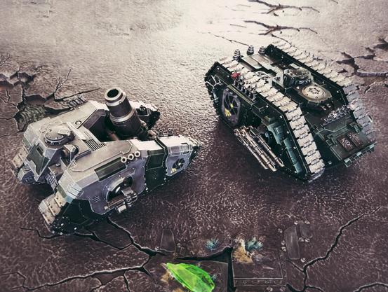 An arquitor bombard and land raider spartan in grey and green.
