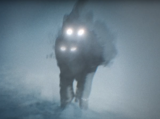 Shadowy wolf with glowing eyes running through the snow. It looks like it might have a bracelet wrapped around one of its front paws, similar to Bang Chan's Chrome Hearts bracelets that he always wears. Also the wolf appears to have four glowing eyes.