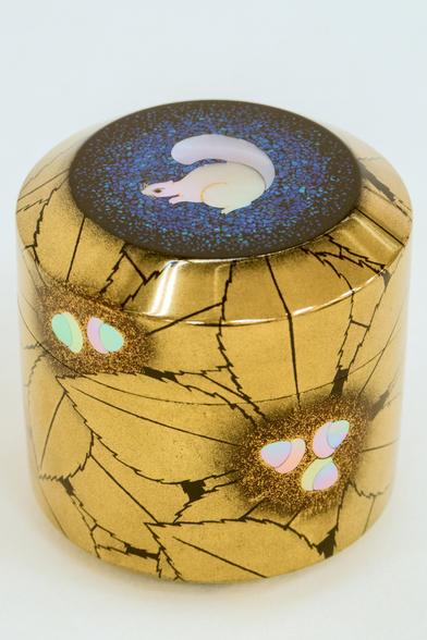 Golden lacquer container with mother of pearl squirrel and acorn inlay