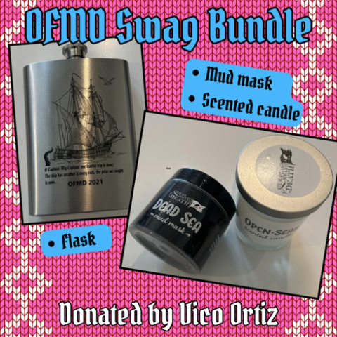 One of the flash auction items donated by Vico Ortiz: an OFMD Swag Bundle, containing a flask, a mud mask and a scented candle. There is a photo of a metal hip flask engraved with a picture of the Revenge, a quote from Walt Whitman's O Captain My Captain, and 'OFMD 2021'. A second photo shows two jars, one containing an 'official OFMD candle' with the scent 'Open Seas', and the other containing an official OFMD Dead Sea mud mask. Both have the show's logo printed on their labels.