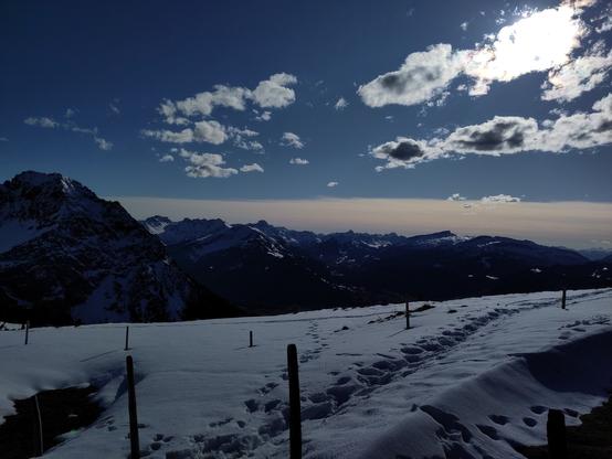 the image shows the alps in the south direction towards austria and switzerland in the late afternoon