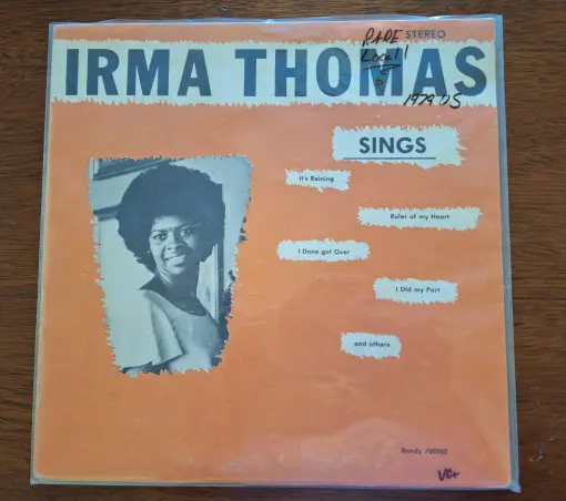 Irma Thomas Sings 
A vinyl record with orange, black and white cover with a photo of Irms