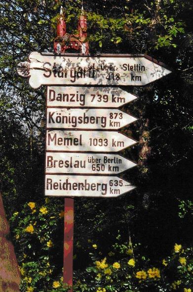 A road sign indicating former German cities at a memorial for the lost eastern territories in Elmshorn, Germany