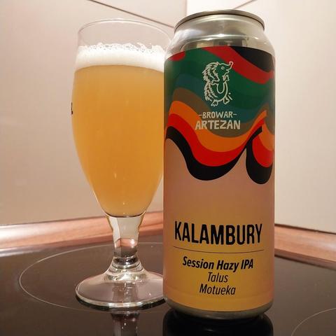 A glass of beer standing next to a 0,5l can. It's a Kalambury session hazy IPA by polish Browar Artezan.