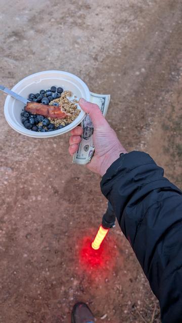 Light saber, breakfast, wad of cash; collecting parking fees at 6am