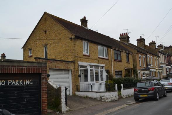 A post war house at the foot of a Victorian terrace.
