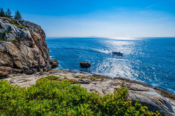 Looking out from high up on cliffs on the Great Head trail over the ocean where a tour boat cruises.
© Tom Goetz. All rights reserved. Training an AI on this image is expressly forbidden.