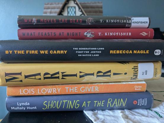 six books stacked.