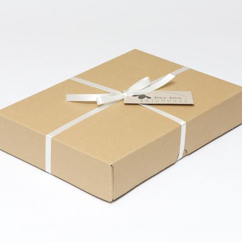Picture shows a closed A4 box tied with ivory ribbon.
