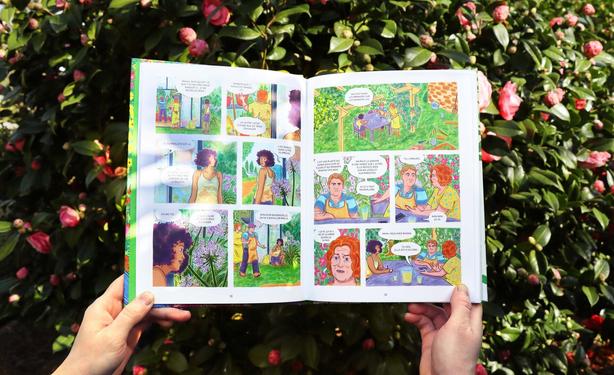 In this second photo, I’ve opened the book to show pages 22 and 23 of the story. There is a dialogue between three characters standing under a pergola covered with Black-eyed Susans, morning glories, clematis, and pandoreas.