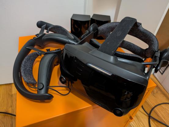 Valve Index VR full kit, sitting on top of an orange box. I'm sad that I've sold this, but I can't use it in my space anymore.