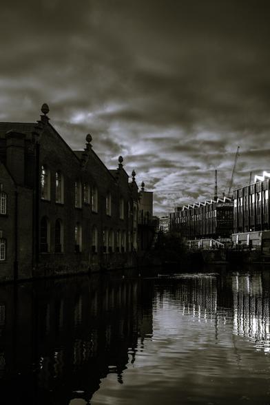Black and white shot of old and modern buildings at sunset on the banks of Regent's Canal at Camden, NW London
Captured by Komeil Karimi