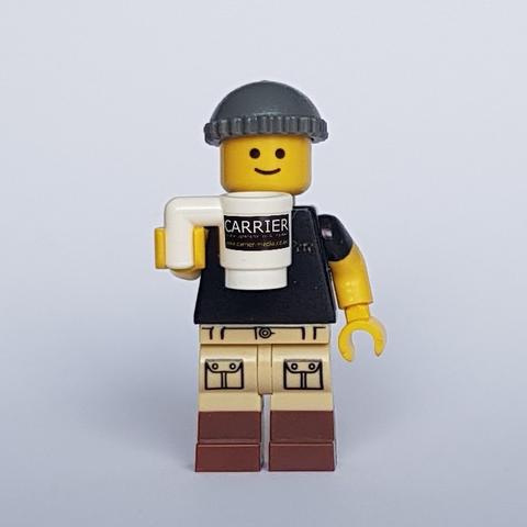 Image is Lego Pete Carrier holding a branded mug.